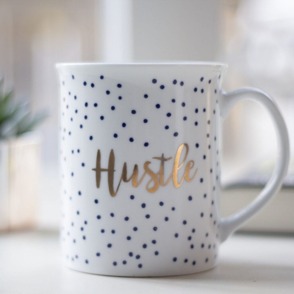 Cup that says “hustle”