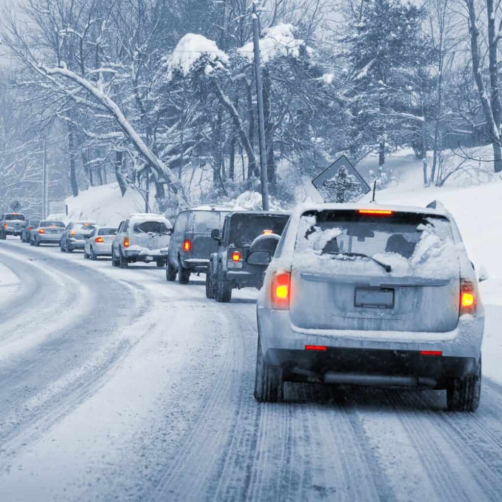 Line up of cars in a snowy setting