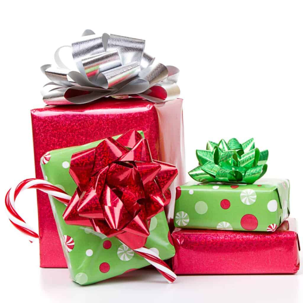 Pile of presents wrapped in red and green holiday themed paper